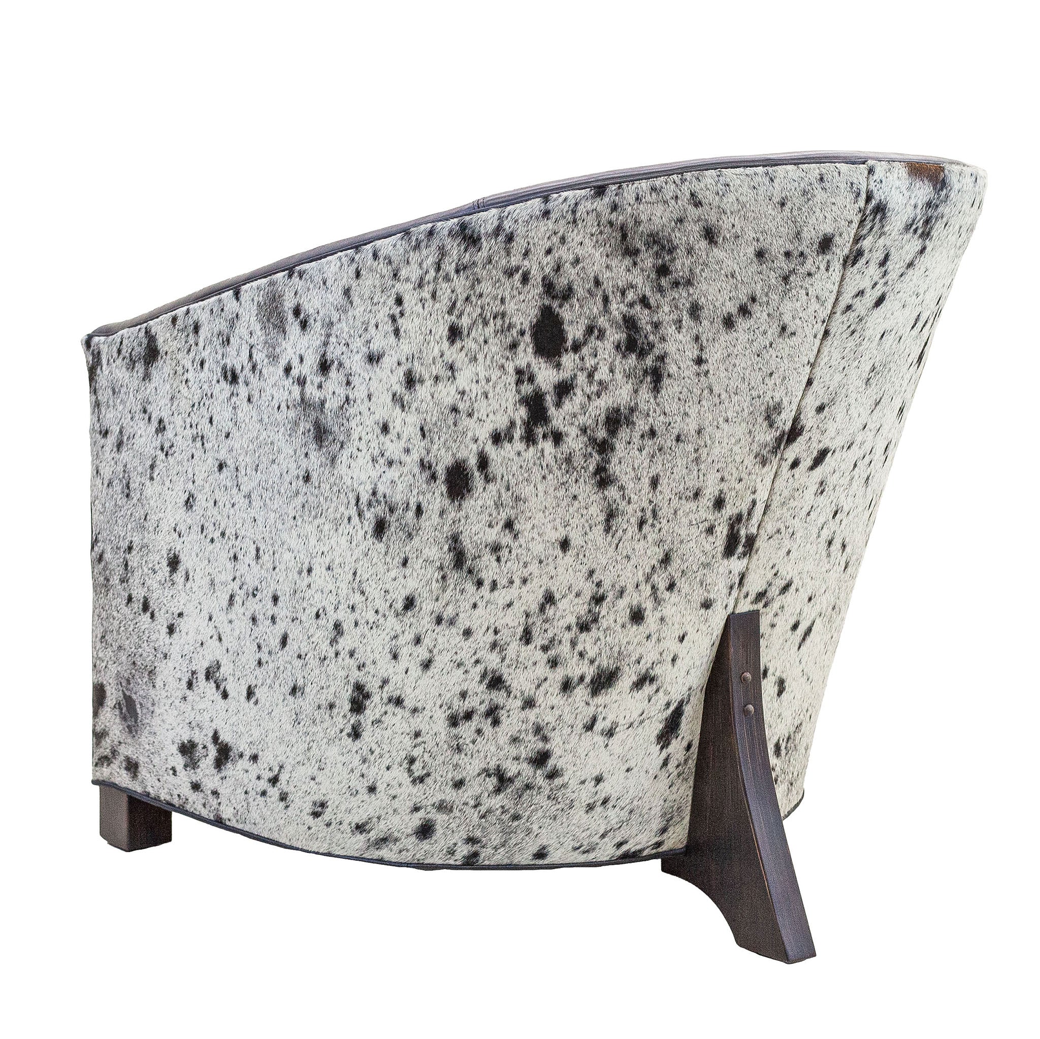 High Roller chair shown in back view with black and white speckled hair-on-hide back panel

