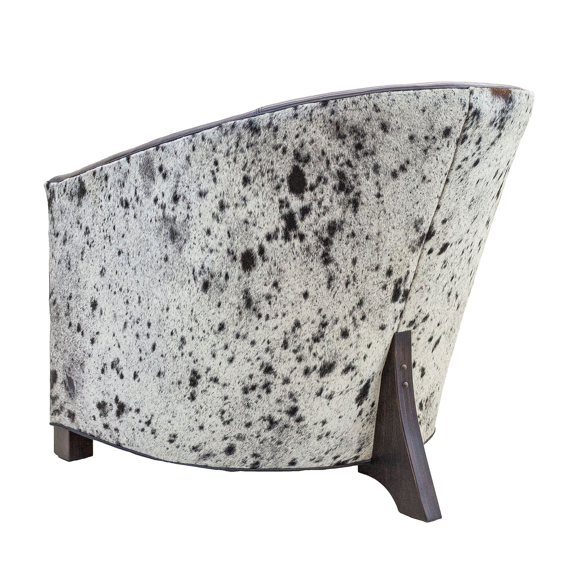 High Roller chair shown in back view with black and white speckled hair-on-hide back panel
