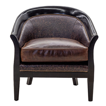 Sebastian chair in full-grain leather with embossed detailing on arms and back, pull-up leather seat, and hand-laced accents, handcrafted in America